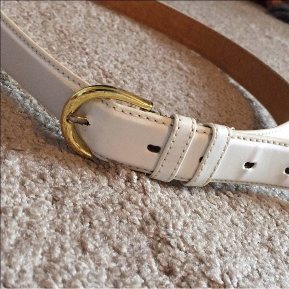 White faux leather belt with golden buckle